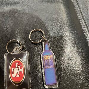KEY RINGS, 2 $ 5 EACH SF 49ERS. SKYY VODKA